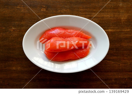 Tarako (cut pieces) as a table background, viewed from directly above. Tarako (cut pieces) as a table background, viewed from directly above. 139169429