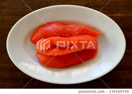 Tarako (cut pieces) as a table background, viewed from directly above. Tarako (cut pieces) as a table background, viewed from directly above. 139169740