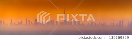 Dubai, United Arab Emirates - Jan 12 2024, Panoramic view of downtown Dubai skyscrapers, with Burj Khalifa in the middle, at dawn in a haze, a view from the sea, Dubai, United Arab Emirates  139169839