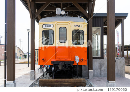 A Nomi Electric Railway (Nomiden) train car preserved and displayed at the east exit of Nomi-Negami Station | Nomiden | Nomi City, Ishikawa Prefecture 139170060