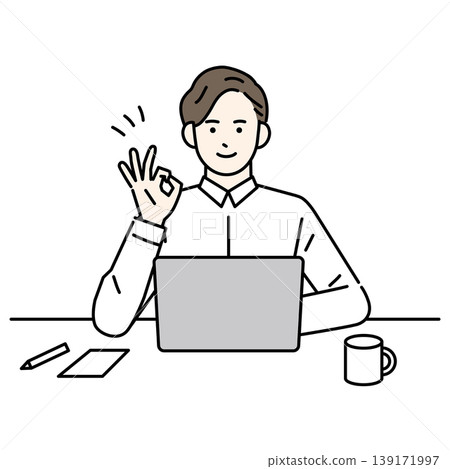 A smiling man gives an OK sign while working on his computer. 139171997