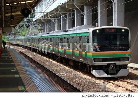 Tokaido Line E231 series train moving empty on a side track at Atami Station 139173983