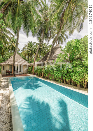 Luxury tropical resort villa private pool palm trees sunshine ocean view paradise travel background outdoors amazing exotic destination scenic architecture high end holiday summer retreat Luxury tropical resort villa private pool palm trees sunshine ocean view paradise travel background outdoors amazing exotic destination scenic architecture high end holiday summer retreat 139174012