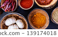 Fantastic top view indian spices colorful ingredients in wooden bowls aromatic masala turmeric chili curry powder coriander peppercorn culinary background organic healthy food composition 139174018
