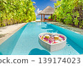 Radiant luxury tourism background summer travel couple honeymoon private pool floating breakfast tropical beach resort palm trees ocean view relaxing romantic vacation exotic villa leisure 139174023