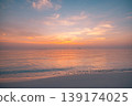 Idyllic tropical sunset beach calm waves relaxation ocean sand sky summer nature shore background travel water horizon golden twilight serene coastal scenery breathtaking maritime paradise 139174025