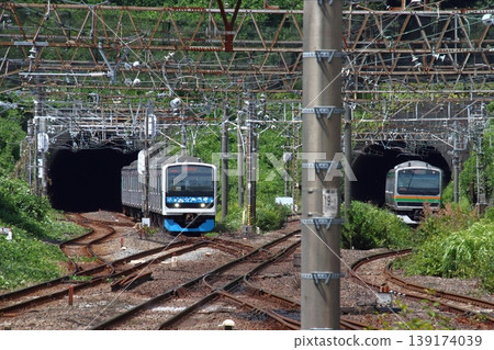 Izu Kyuko Line 3000 series train and Tokaido Line E231 series train arriving at Atami Station. Izu Kyuko Line 3000 series train and Tokaido Line E231 series train arriving at Atami Station. 139174039