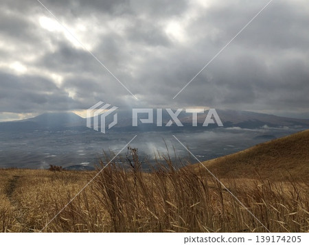 A mountain visible beyond the meadow A mountain visible beyond the meadow 139174205
