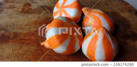 Orange and White Striped Sweet Dumplings 139174280