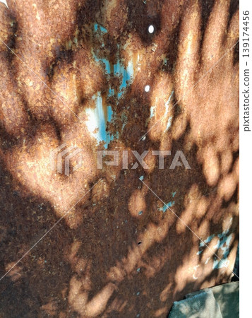 close up of a rough rusty metal surface 139174456