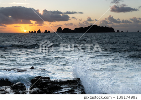 Sunrise and crashing waves off the coast of Nanatsu-iwa in the Hyuga Sea, Nichinan City, Miyazaki Prefecture. Sunrise and crashing waves off the coast of Nanatsu-iwa in the Hyuga Sea, Nichinan City, Miyazaki Prefecture. 139174992