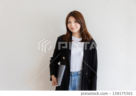 A woman with a laptop A woman with a laptop 139175501