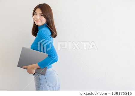 Portrait of a young woman with a laptop: Business and lifestyle Portrait of a young woman with a laptop: Business and lifestyle 139175816