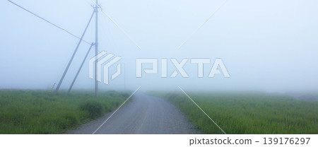 A serene summer scene at the very edge of Hokkaido's Notsuke Peninsula, shrouded in sea fog. A serene summer scene at the very edge of Hokkaido's Notsuke Peninsula, shrouded in sea fog. 139176297