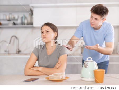 Angry guy swears at young girl, family quarrel. Angry guy swears at young girl, family quarrel. 139176354