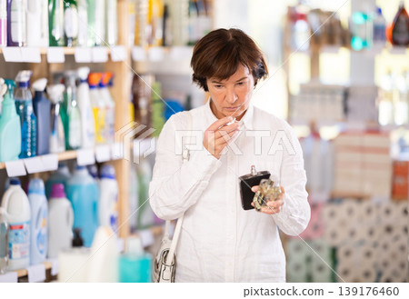 Elderly woman chooses perfume in store 139176460