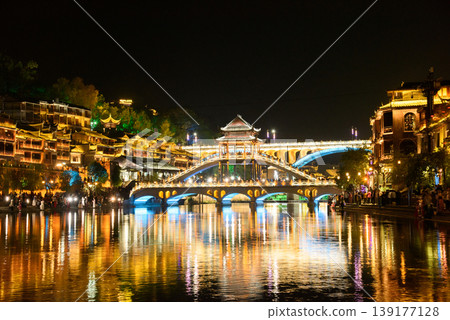 Fenghuang Ancient Town. Located in Fenghuang County. Southwest of HuNan Province, China. Fenghuang is a popular tourist destination of Asia. Fenghuang Ancient Town. Located in Fenghuang County. Southwest of HuNan Province, China. Fenghuang is a popular tourist destination of Asia. 139177128
