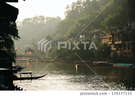 Fenghuang Ancient Town. Located in Fenghuang County. Southwest of HuNan Province, China. Fenghuang is a popular tourist destination of Asia. Fenghuang Ancient Town. Located in Fenghuang County. Southwest of HuNan Province, China. Fenghuang is a popular tourist destination of Asia. 139177133