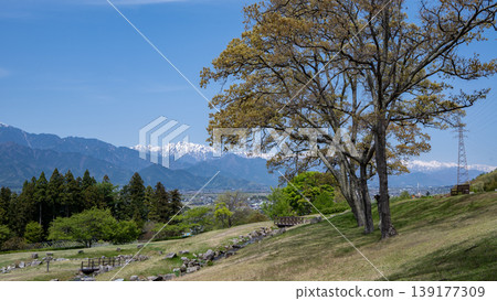 The snow-capped Northern Alps viewed from a park surrounded by fresh greenery, Azumino City, Nagano Prefecture. The snow-capped Northern Alps viewed from a park surrounded by fresh greenery, Azumino City, Nagano Prefecture. 139177309