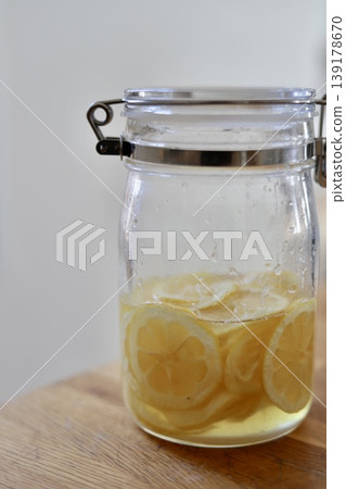 Homemade lemon syrup made in a sealed jar Homemade lemon syrup made in a sealed jar 139178670