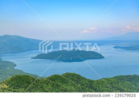 Lake Kussharo and the surrounding mountains as seen from Tsubetsu Pass in Hokkaido 139179028