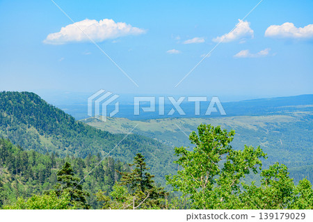 Lake Kussharo and the surrounding mountains as seen from Tsubetsu Pass in Hokkaido 139179029