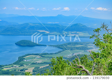 Lake Kussharo and the surrounding mountains as seen from Tsubetsu Pass in Hokkaido 139179030
