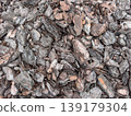 Closeup top view of bark mulch wood texture background made of natural brown tree chips. Rustic organic surface for garden design, landscaping, eco backdrop, material pattern and earthy wallpaper. 139179304