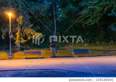 Evening Park Scene with Benches and Streetlight Evening Park Scene with Benches and Streetlight 139180030