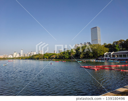 Kayakers Enjoying a Scenic Day at Nanhu Lake in Nanning, China Kayakers Enjoying a Scenic Day at Nanhu Lake in Nanning, China 139180496