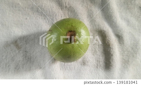 Whole Ripe Green Guava Fruit on White Textured Background 139181041