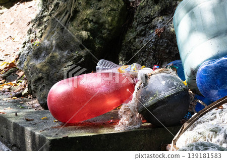 Marine plastic waste and floats washed ashore on the beach Marine plastic waste and floats washed ashore on the beach 139181583