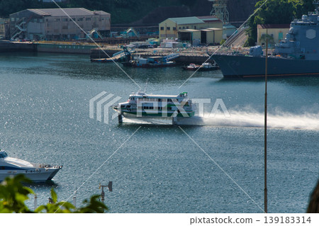 A hydrofoil boat sailing through Nagasaki Port. A hydrofoil boat sailing through Nagasaki Port. 139183314