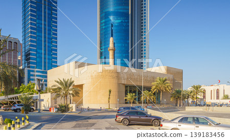 Manama, Bahrain - Jan 08 2024, panoramic view of the facade of the Museum of the History of the Koran, Brit Al Quran, House of Quran, with a skyscraper on background, in the daytime, Manama, Bahrain Manama, Bahrain - Jan 08 2024, panoramic view of the facade of the Museum of the History of the Koran, Brit Al Quran, House of Quran, with a skyscraper on background, in the daytime, Manama, Bahrain 139183456