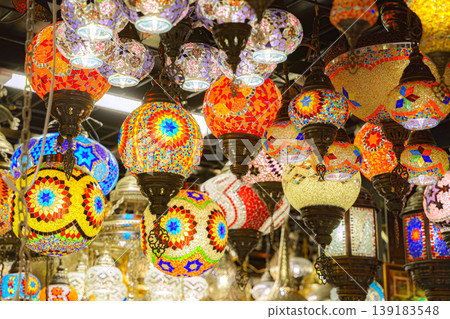Manama, Bahrain - Jan 08 2024, A view from below of a variety of many colorful vintage Arabic and Persian lamps and chandeliers, Fanoos, Manama, Bahrain 139183548