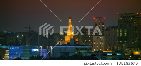 Doha, Qatar - Jan 07 2024, Panoramic view of the city, a park in the foreground, the Islamic cultural center Abdulah Bin Al Mahmoud is captured in the center of the frame, at evening, Doha, Qatar Doha, Qatar - Jan 07 2024, Panoramic view of the city, a park in the foreground, the Islamic cultural center Abdulah Bin Al Mahmoud is captured in the center of the frame, at evening, Doha, Qatar 139183679