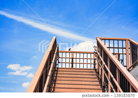 Stairs extending into the blue sky Stairs extending into the blue sky 139183870