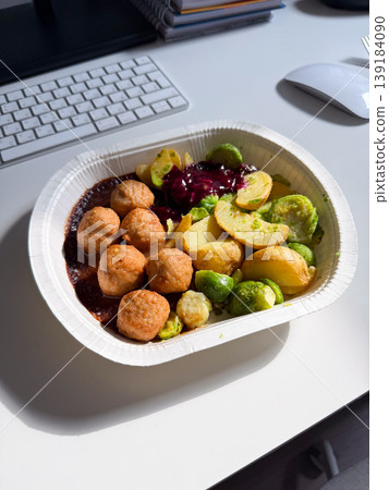 Swedish meatball meal with potato and Brussels sprout served in a takeaway container. Comfort food, fast lunch, convenience, and casual dining experience Swedish meatball meal with potato and Brussels sprout served in a takeaway container. Comfort food, fast lunch, convenience, and casual dining experience 139184090