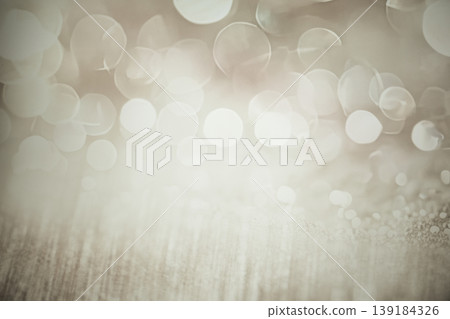 Soft bokeh background with blurred lights creating a dreamy atmosphere, ideal for design projects, invitations, or holiday themes, featuring warm tones and gentle textures Soft bokeh background with blurred lights creating a dreamy atmosphere, ideal for design projects, invitations, or holiday themes, featuring warm tones and gentle textures 139184326