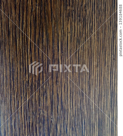 Beautiful brown wood texture with vertical wood grain; natural background material. Beautiful brown wood texture with vertical wood grain; natural background material. 139184688