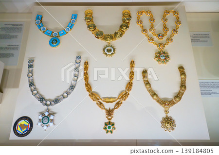 Doha, Qatar - Jan 06 2024, a close up view of historical vintage royal jewellery, six necklaces, exhibits of National Museum of Qatar, on monochrome background, under the glass, Doha, Qatar 139184805