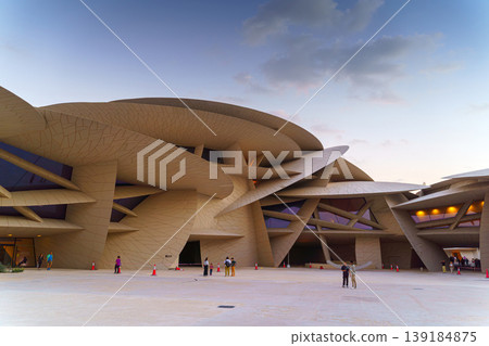 Doha, Qatar - Jan 06 2024, a panoramic view of National Museum of Qatar courtyard, patio, with some people in it, in shape of desert rose, at evening, Doha, Qatar Doha, Qatar - Jan 06 2024, a panoramic view of National Museum of Qatar courtyard, patio, with some people in it, in shape of desert rose, at evening, Doha, Qatar 139184875