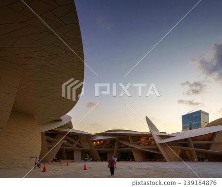 Doha, Qatar - Jan 06 2024, a panoramic view of National Museum of Qatar courtyard, patio, with some people in it, in shape of desert rose, at evening, Doha, Qatar Doha, Qatar - Jan 06 2024, a panoramic view of National Museum of Qatar courtyard, patio, with some people in it, in shape of desert rose, at evening, Doha, Qatar 139184876