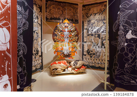 Doha, Qatar - Jan 06 2024, A view of the tapestry with various patterns and drawings, in the middle is a round painting with a skeleton, the history of coffee, National Museum of Qatar, Doha, Qatar Doha, Qatar - Jan 06 2024, A view of the tapestry with various patterns and drawings, in the middle is a round painting with a skeleton, the history of coffee, National Museum of Qatar, Doha, Qatar 139184878