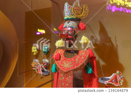 Doha, Qatar - Jan 06 2024, A close-up view of ancient ceremonial masks and clothes, masks depict various scary faces, history of coffee,on exhibition of National Museum of Qatar, Doha, Qatar 139184879
