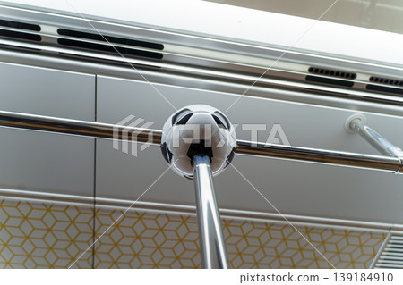 Doha, Qatar - Jan 06 2024, a close up view of football ball shaped handrail, railing in van of Doha metro, subway,  in honour of 2022 FIFA World Cup, Doha, Qatar 139184910
