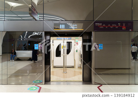 Doha, Qatar - Jan 06 2024, a view of open door of a metro van, silver mirror station wall in the foreground, Doha, Qatar 139184912