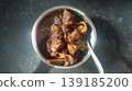 Rich and Spicy Chicken Masala Curry in Stainless Steel Serving Bowl 139185200