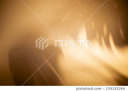 Abstract blurred background with warm golden tones and soft light patterns creating a smooth gradient effect, ideal for artistic or design applications Abstract blurred background with warm golden tones and soft light patterns creating a smooth gradient effect, ideal for artistic or design applications 139185264