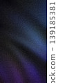 Dark, moody abstract background with a grainy texture and gradient blend of deep navy blue, vibrant purple, and black. Ideal for futuristic, luxury, or screen designs 139185381